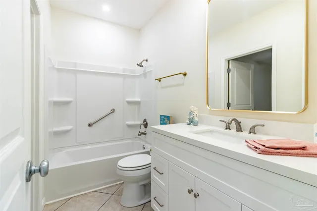 a kitchen with stainless steel appliances granite countertop a sink and a refrigerator
