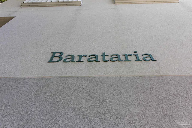 a view of an empty room with a kitchen