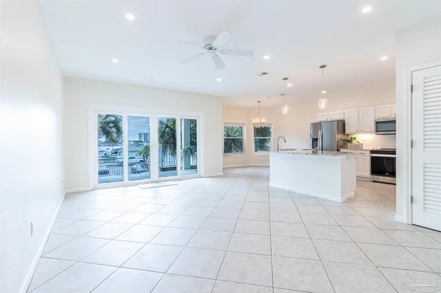 a view of a kitchen with a sink and cabinets