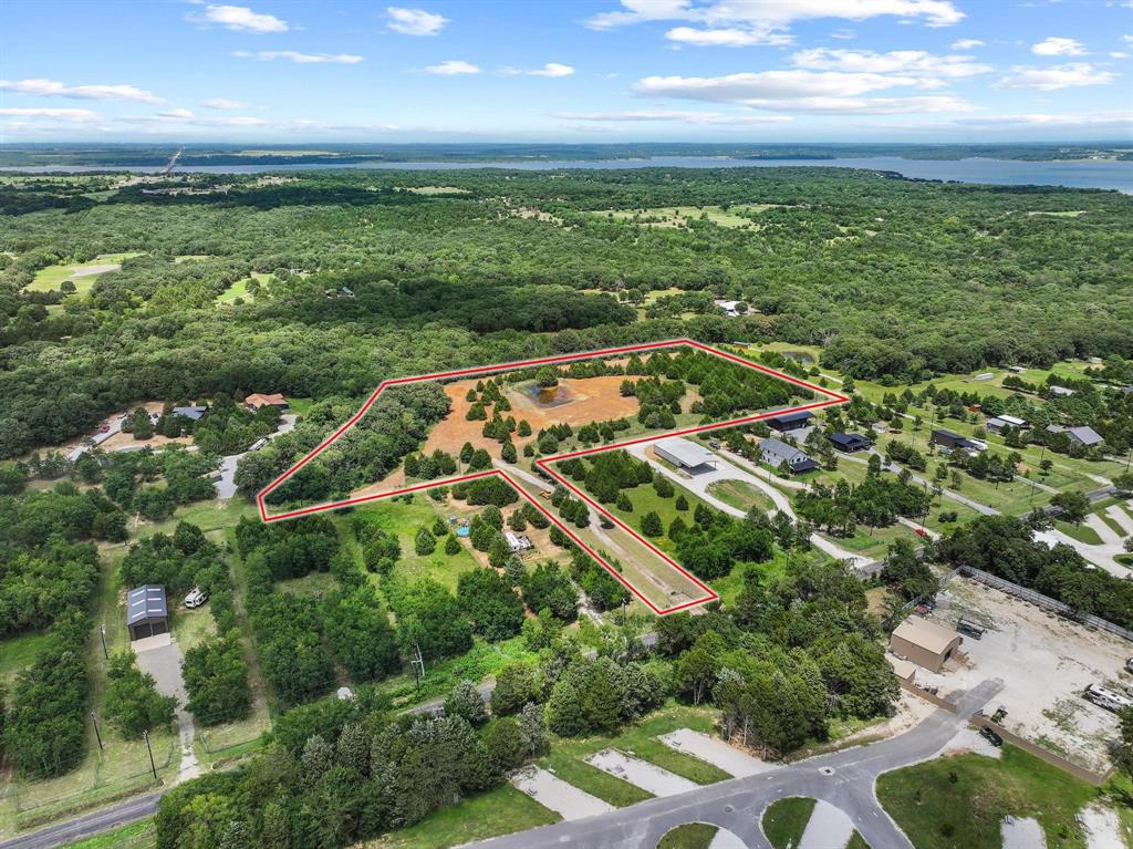 1445 Cedar Mills Road Gordonville, TX 76245 - Photo 15 of 28 Expansive lot featuring a mix of cleared land and mature trees, surrounded by extensive natural foliage