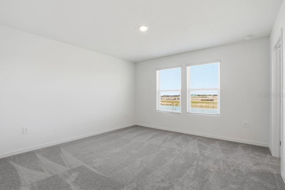 13243 Commons Avenue Parrish, FL 34219 - Photo 13 of 44 an empty room with a window