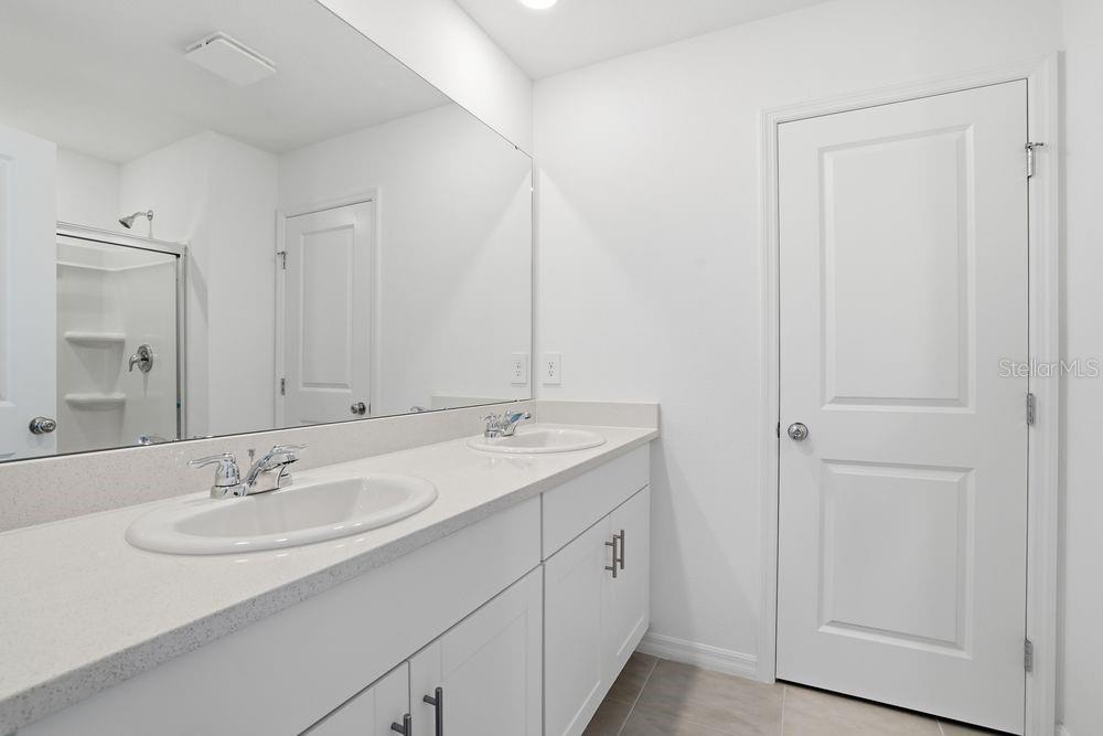 13243 Commons Avenue Parrish, FL 34219 - Photo 16 of 44 a bathroom with a sink and a mirror