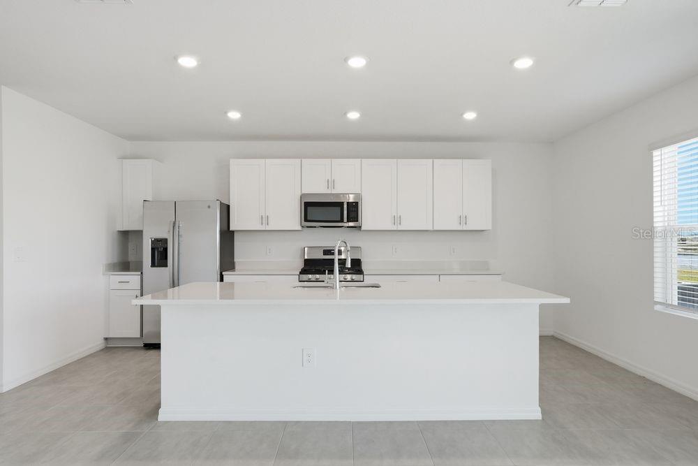 13243 Commons Avenue Parrish, FL 34219 - Photo 2 of 44 a view of a kitchen with stainless steel appliances