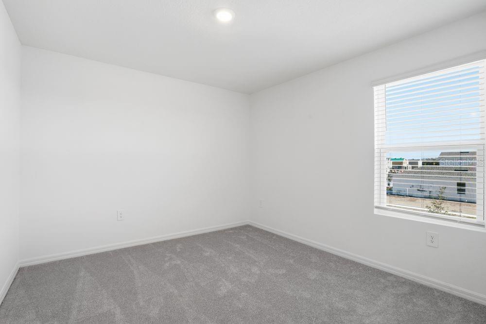 13243 Commons Avenue Parrish, FL 34219 - Photo 21 of 44 a view of an empty room and window