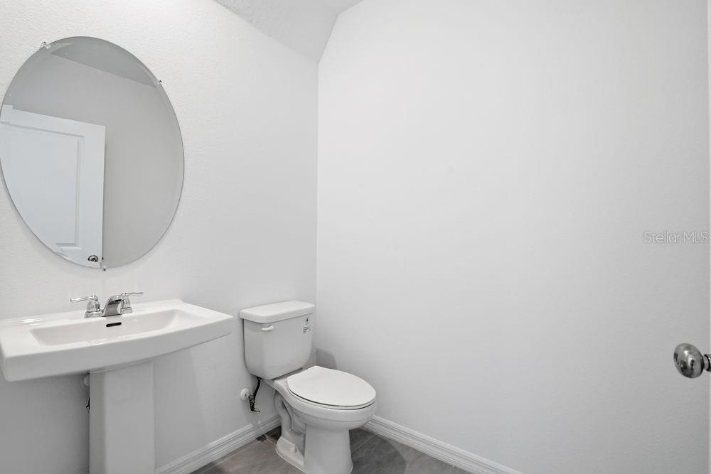 13243 Commons Avenue Parrish, FL 34219 - Photo 26 of 44 a bathroom with a sink toilet and a mirror