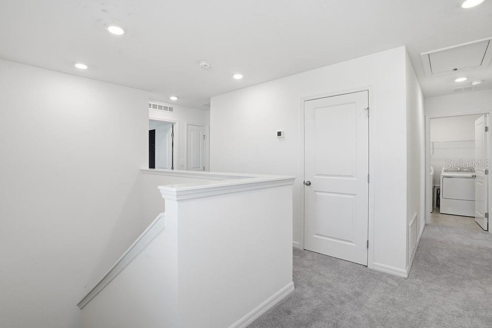 13243 Commons Avenue Parrish, FL 34219 - Photo 28 of 44 a view of a hallway to rooms