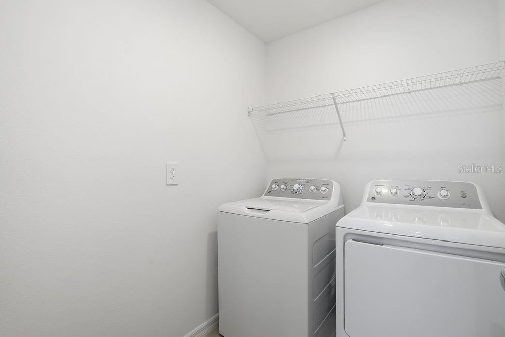13243 Commons Avenue Parrish, FL 34219 - Photo 29 of 44 a utility room with dryer and washer