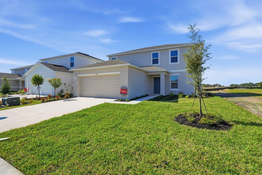 13243 Commons Avenue Parrish, FL 34219 - Photo 35 of 44 a house view with a garden space