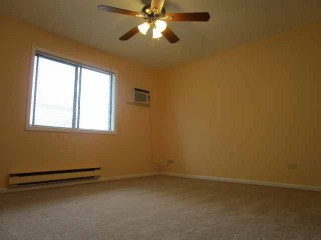 633 South Virginia Road, Unit 316 Crystal Lake, IL 60014 - Photo 13 of 14 a view of room with window and ceiling fan