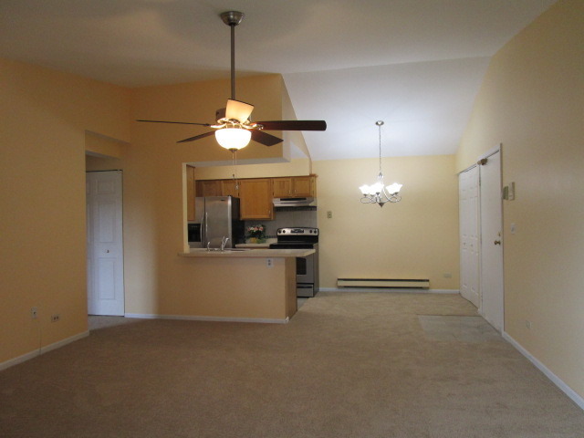 633 South Virginia Road, Unit 316 Crystal Lake, IL 60014 - Photo 5 of 14 a view of a kitchen with a sink and chandelier