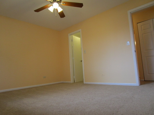 633 South Virginia Road, Unit 316 Crystal Lake, IL 60014 - Photo 8 of 14 a view of an empty room with a window