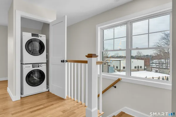 a view of a hallway with washer and dryer