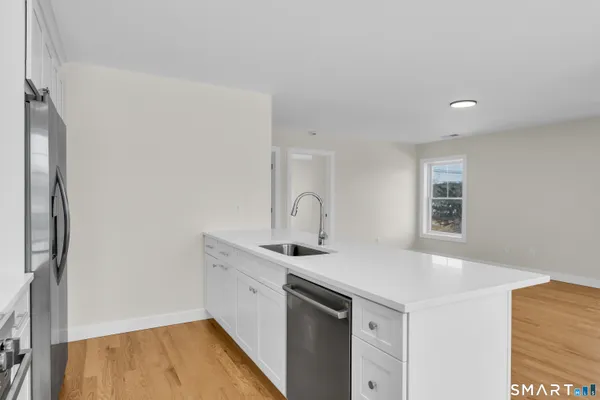 a room with a sink and a mirror