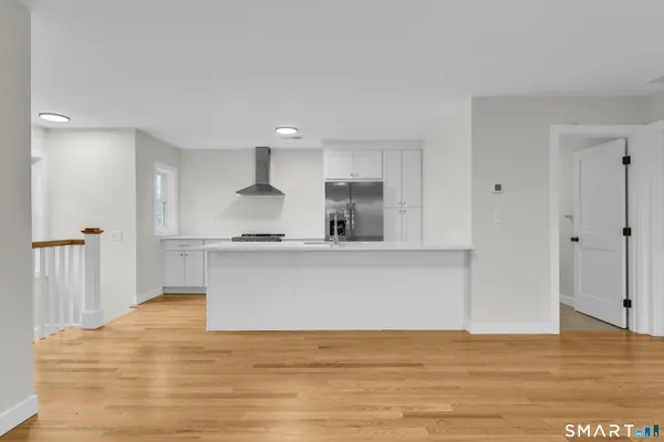 a view of kitchen with wooden floor
