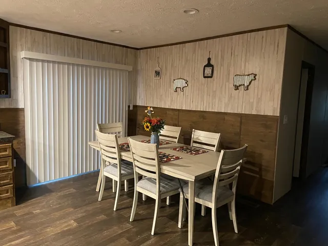 a kitchen with a sink a window and cabinets