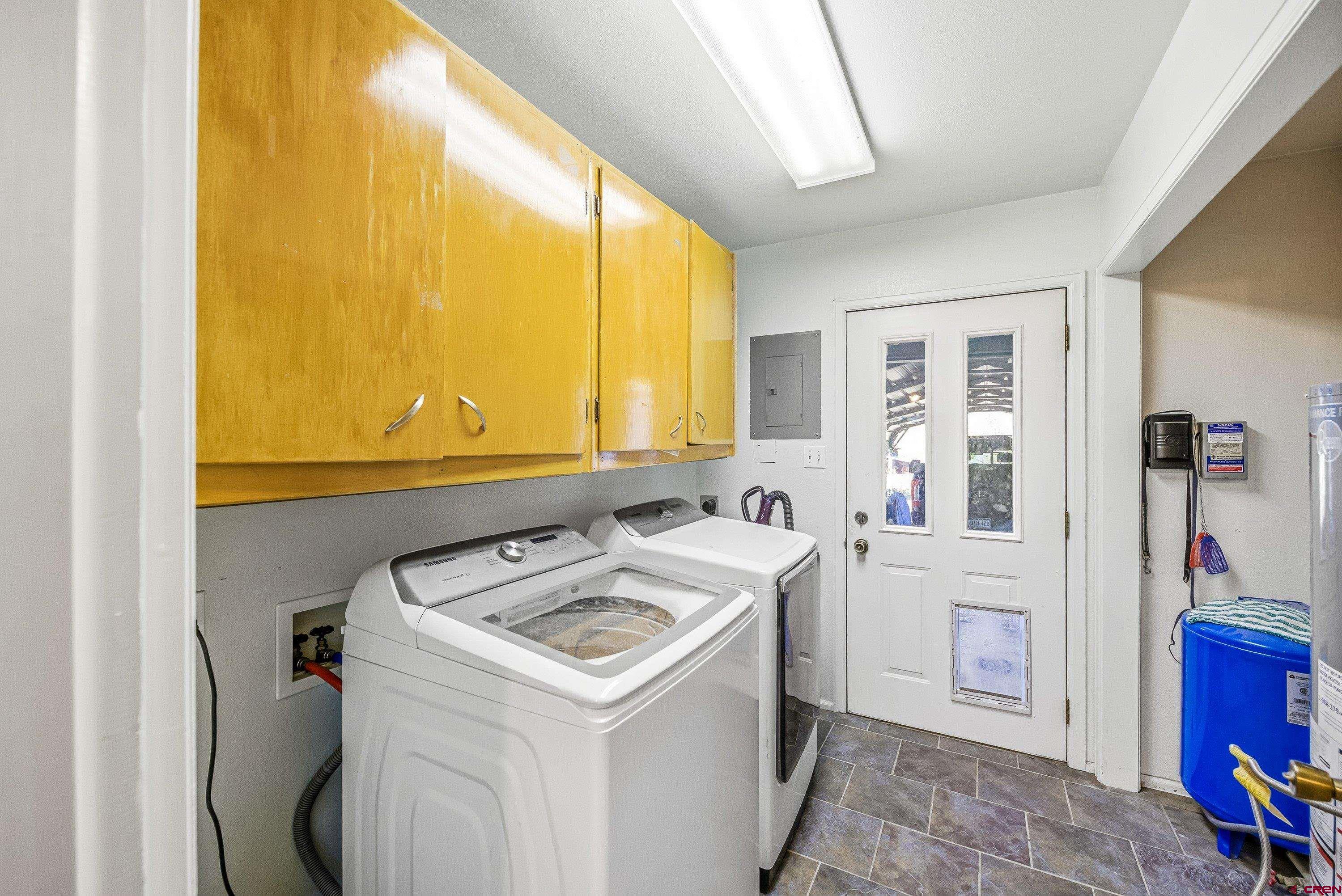 16459 Grange Road Paonia, CO 81428 - Photo 14 of 28 a utility room with dryer and washer