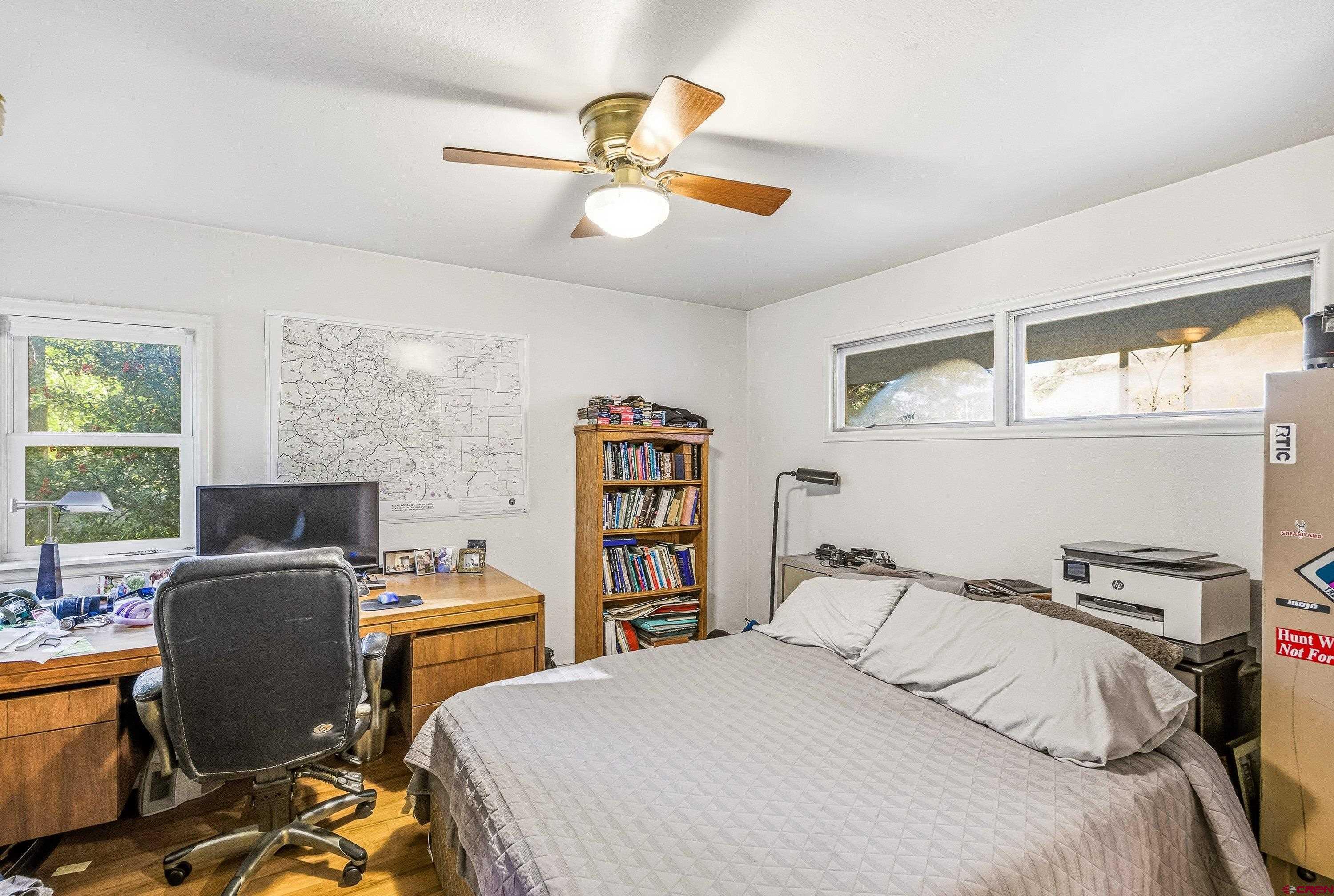 16459 Grange Road Paonia, CO 81428 - Photo 18 of 28 a bedroom with a bed and a desk
