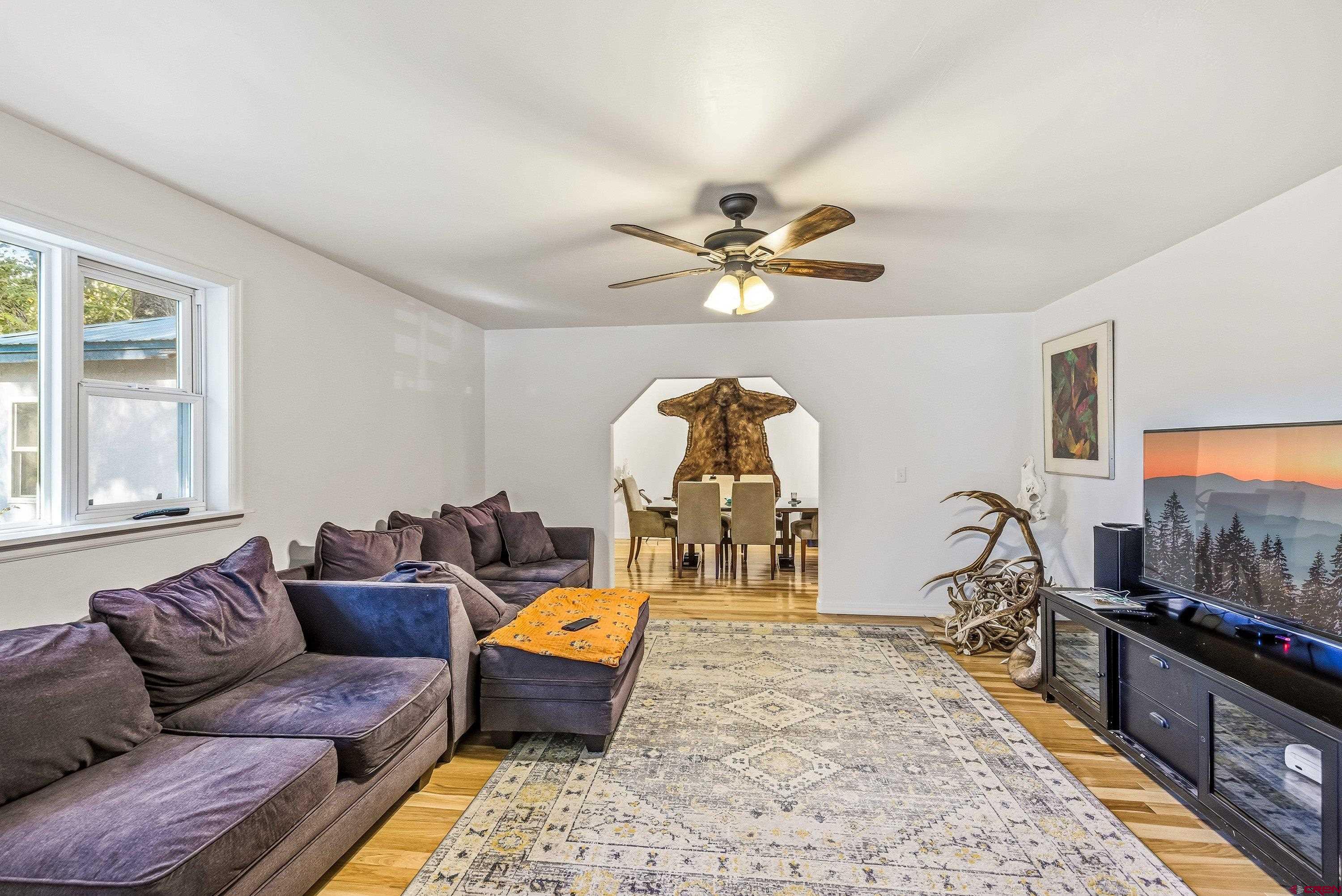 16459 Grange Road Paonia, CO 81428 - Photo 6 of 28 a living room with furniture and a flat screen tv