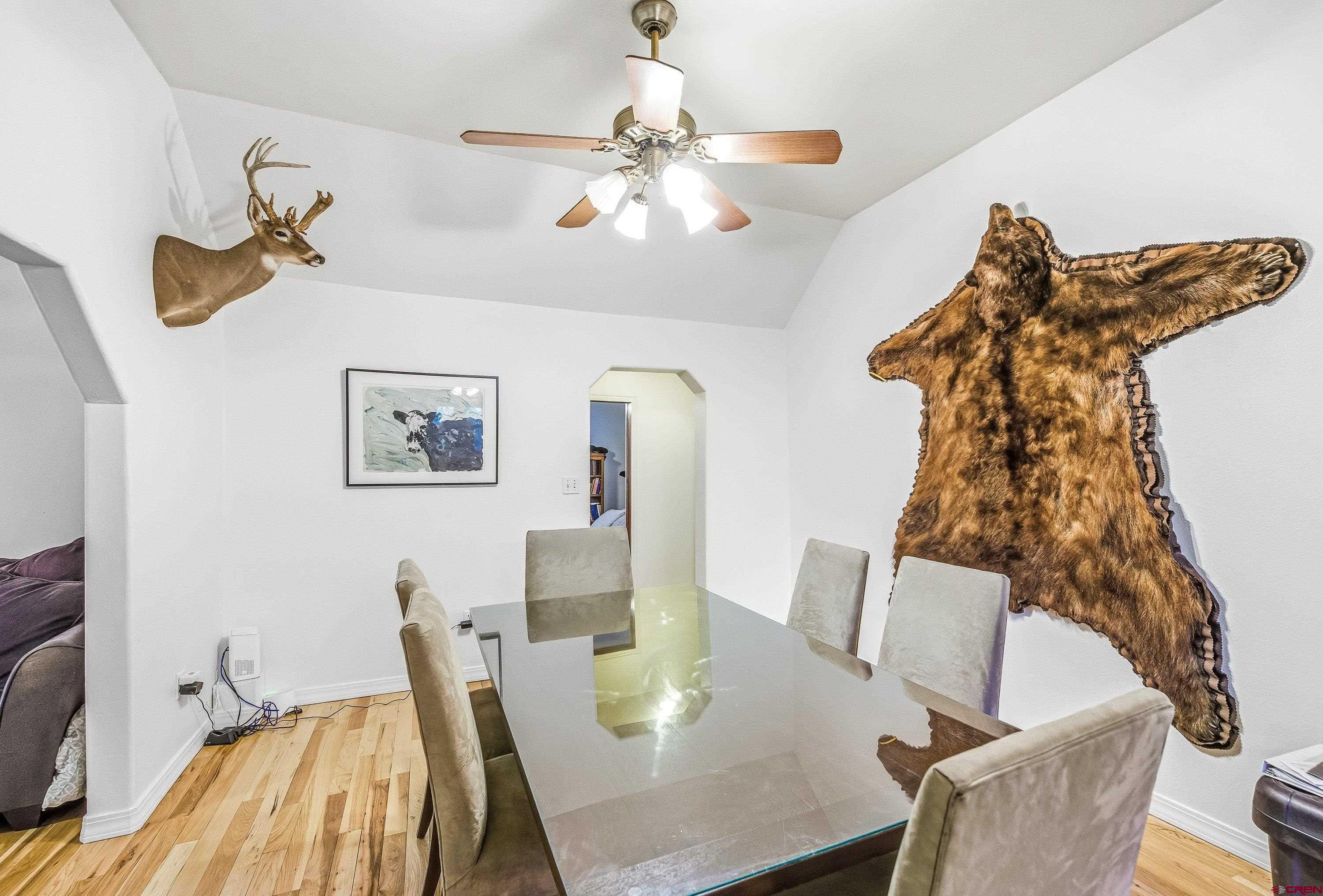 16459 Grange Road Paonia, CO 81428 - Photo 9 of 28 a view of a dining room with furniture and wooden floor