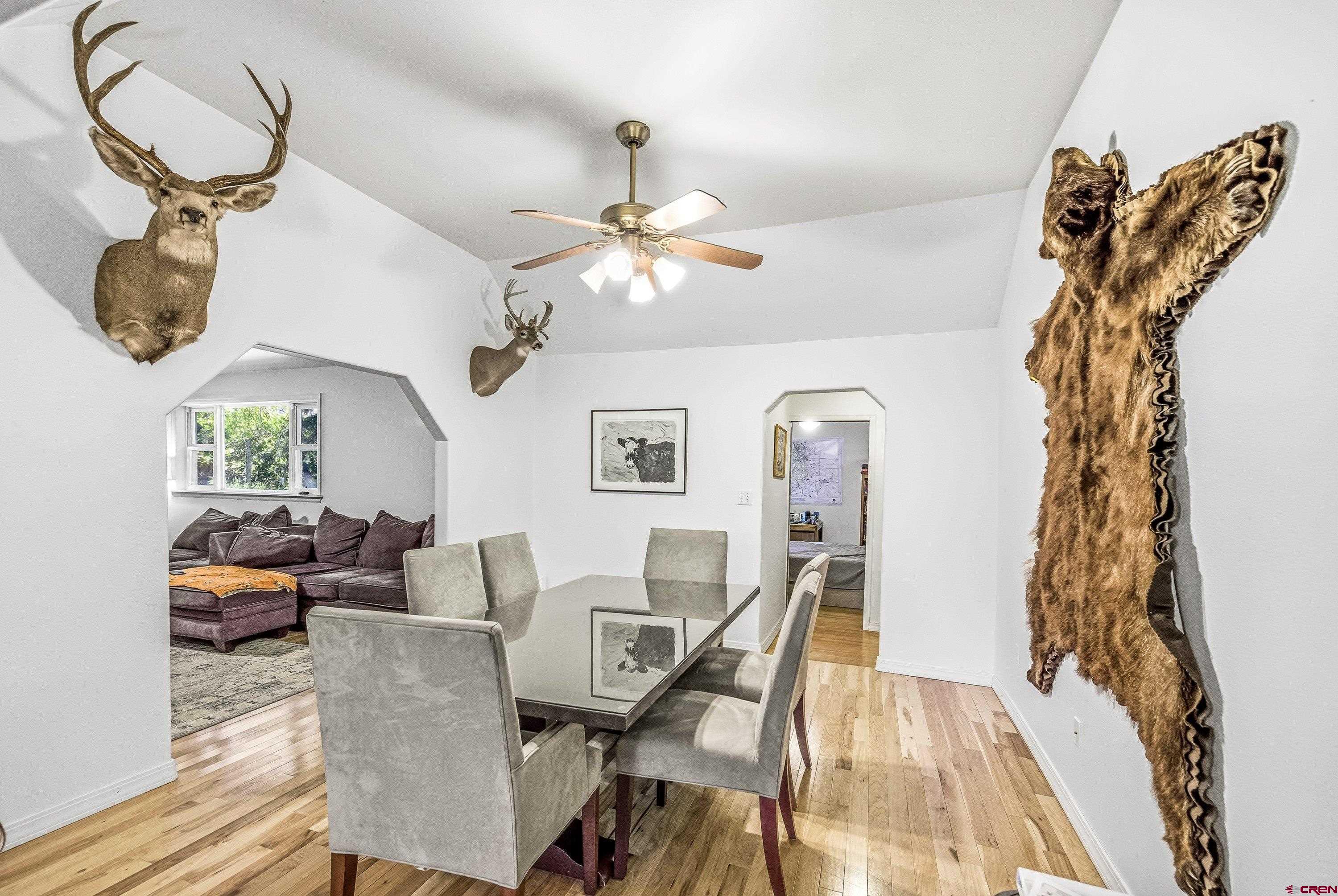 16459 Grange Road Paonia, CO 81428 - Photo 10 of 28 a view of a dining room with furniture and chandelier