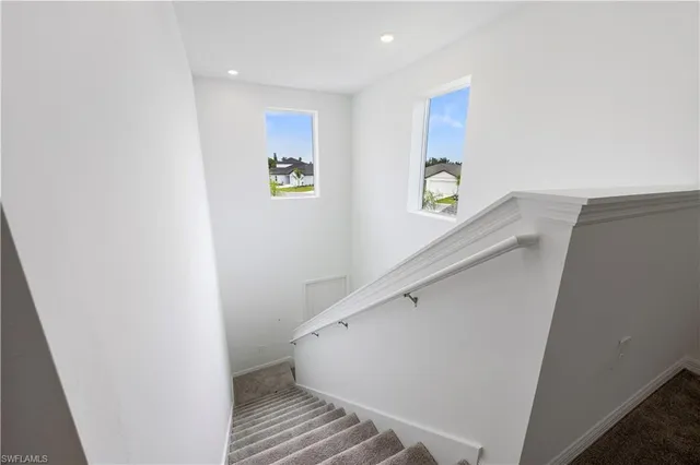 a view of entryway with stairs and wooden floor
