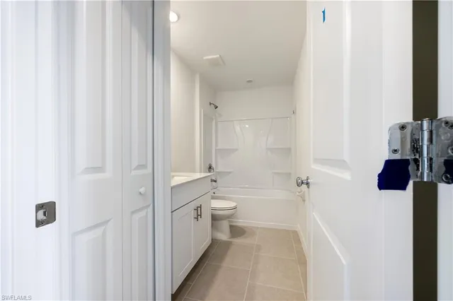 a bathroom with a tub sink and toilet
