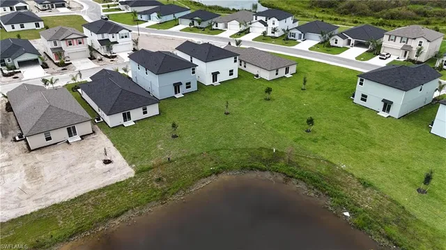 an aerial view of a house with garden space and street view