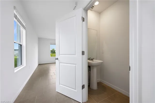 a view of a hallway with a white walls