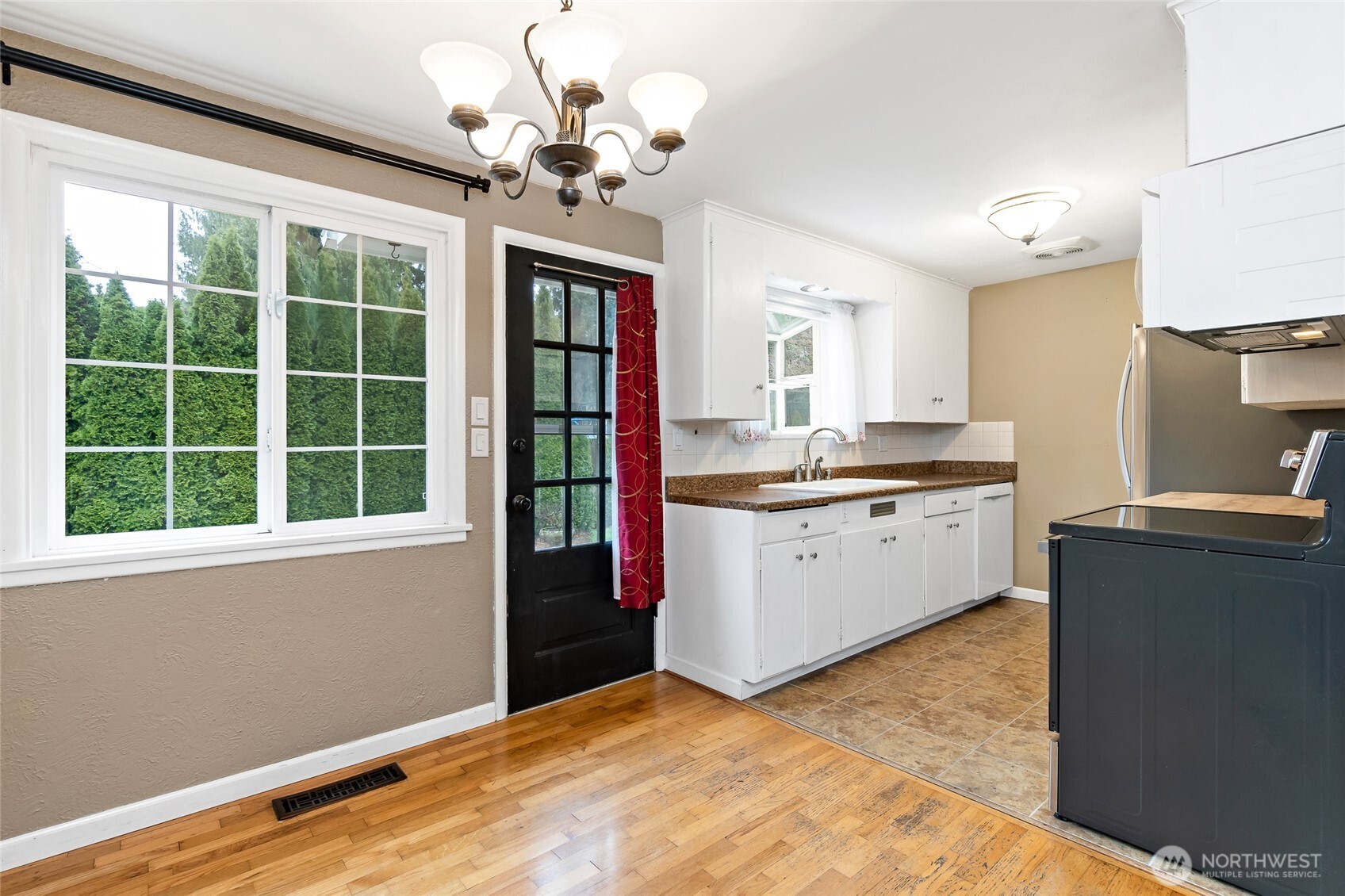 527 Ramsdell Street Fircrest, WA 98466 - Photo 11 of 40 a kitchen that has a lot of cabinets and wooden floor
