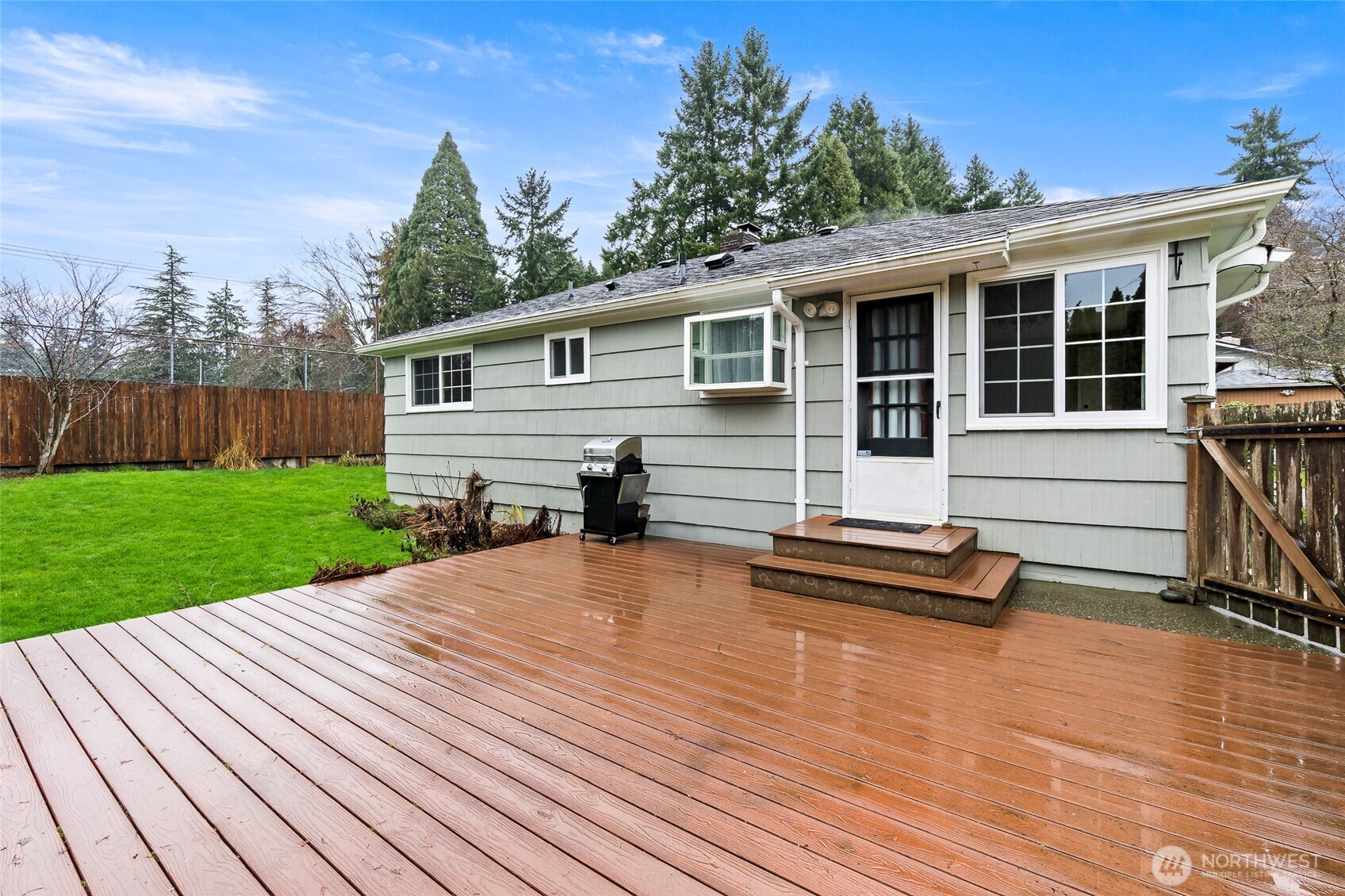 527 Ramsdell Street Fircrest, WA 98466 - Photo 27 of 40 a front view of house with deck outdoor seating and yard
