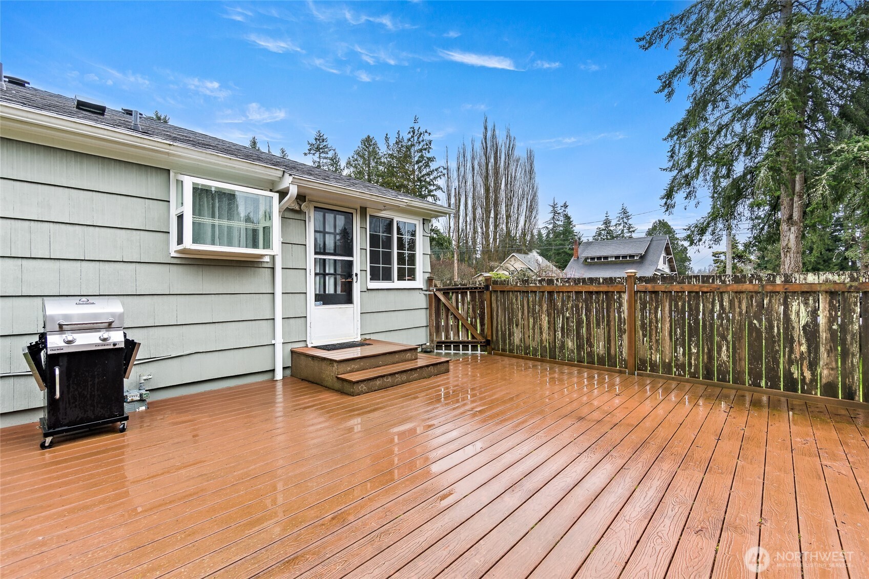 527 Ramsdell Street Fircrest, WA 98466 - Photo 28 of 40 a view of a roof deck with wooden floor and fence