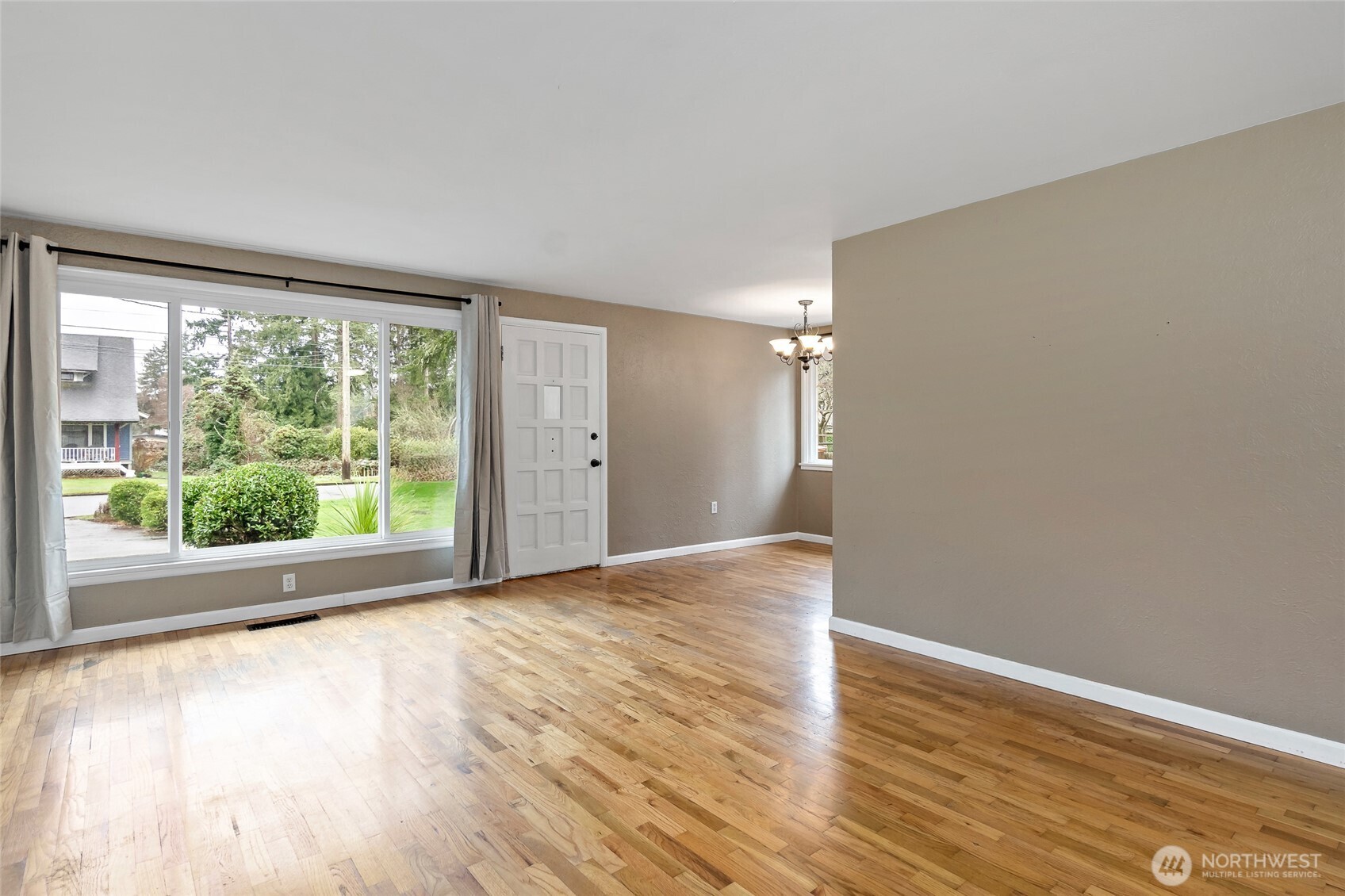 527 Ramsdell Street Fircrest, WA 98466 - Photo 3 of 40 a view of empty room with wooden floor and fan
