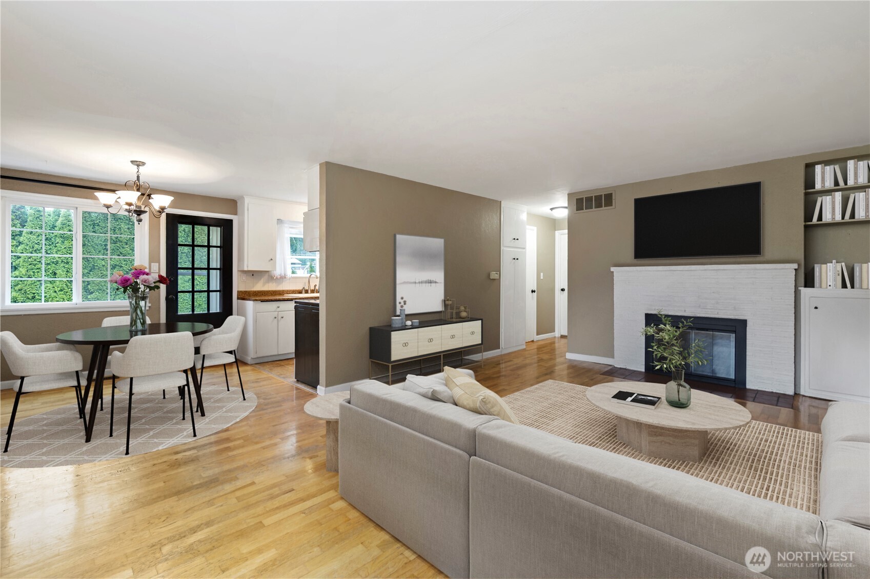 527 Ramsdell Street Fircrest, WA 98466 - Photo 8 of 40 a living room with furniture a flat screen tv and a fireplace