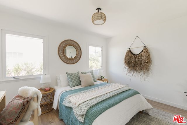 a bedroom with a bed and a chair