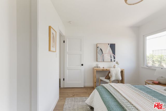 a bedroom with a bed and a fireplace