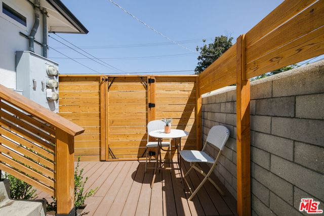 a view of balcony with chairs