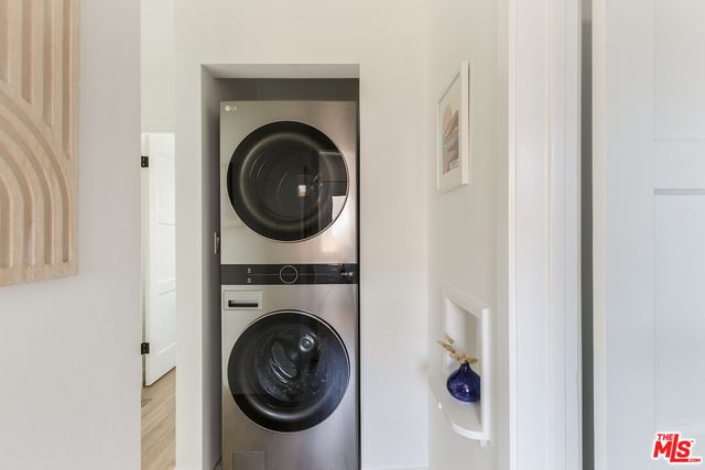 a view of a hallway with washer and dryer