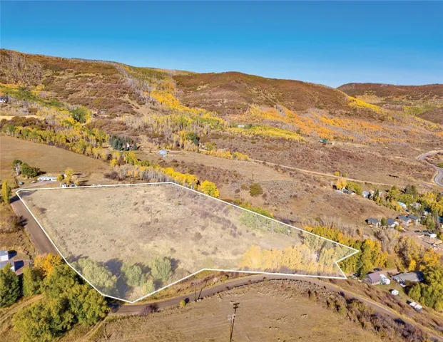 a view of a mountain from a yard
