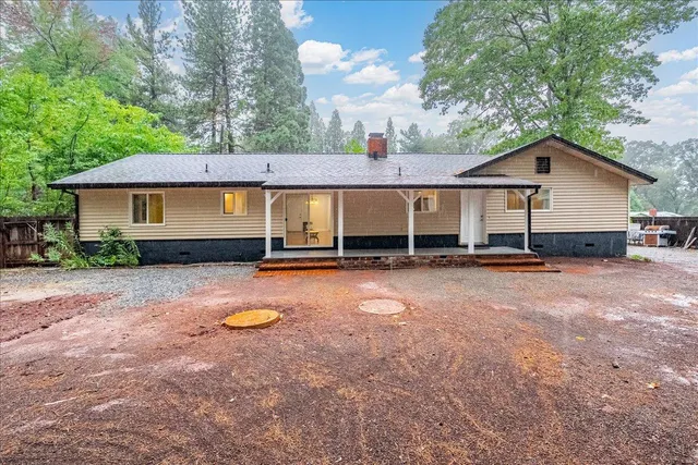a house view with a backyard space