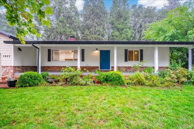 a front view of a house with garden