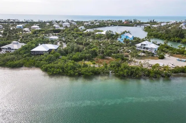 an aerial view of residential house with outdoor space and lake view