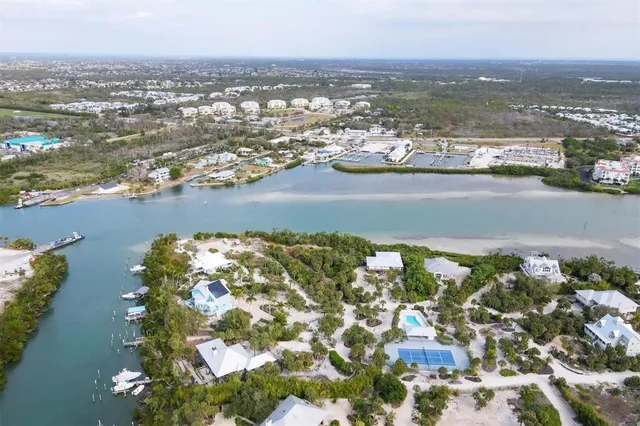 an aerial view of residential building with ocean view