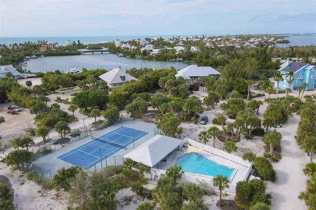 an aerial view of a house with a lake view