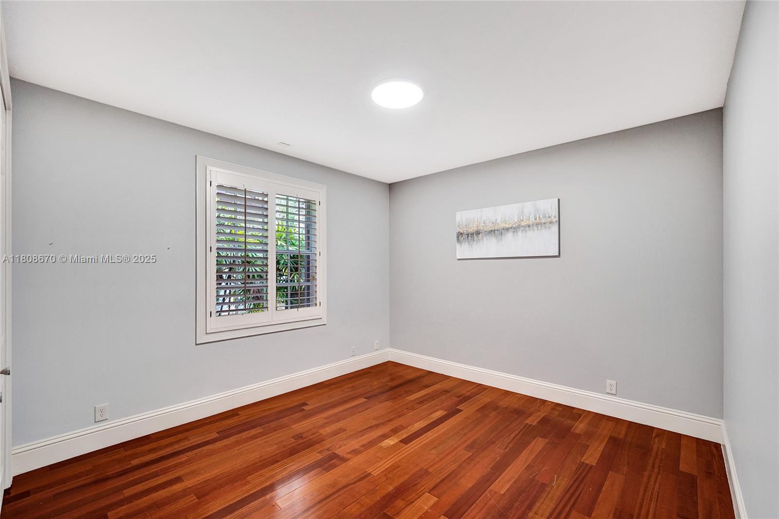 169 Dockside Circle Weston, FL 33327 - Photo 30 of 61 an empty room with wooden floor and windows