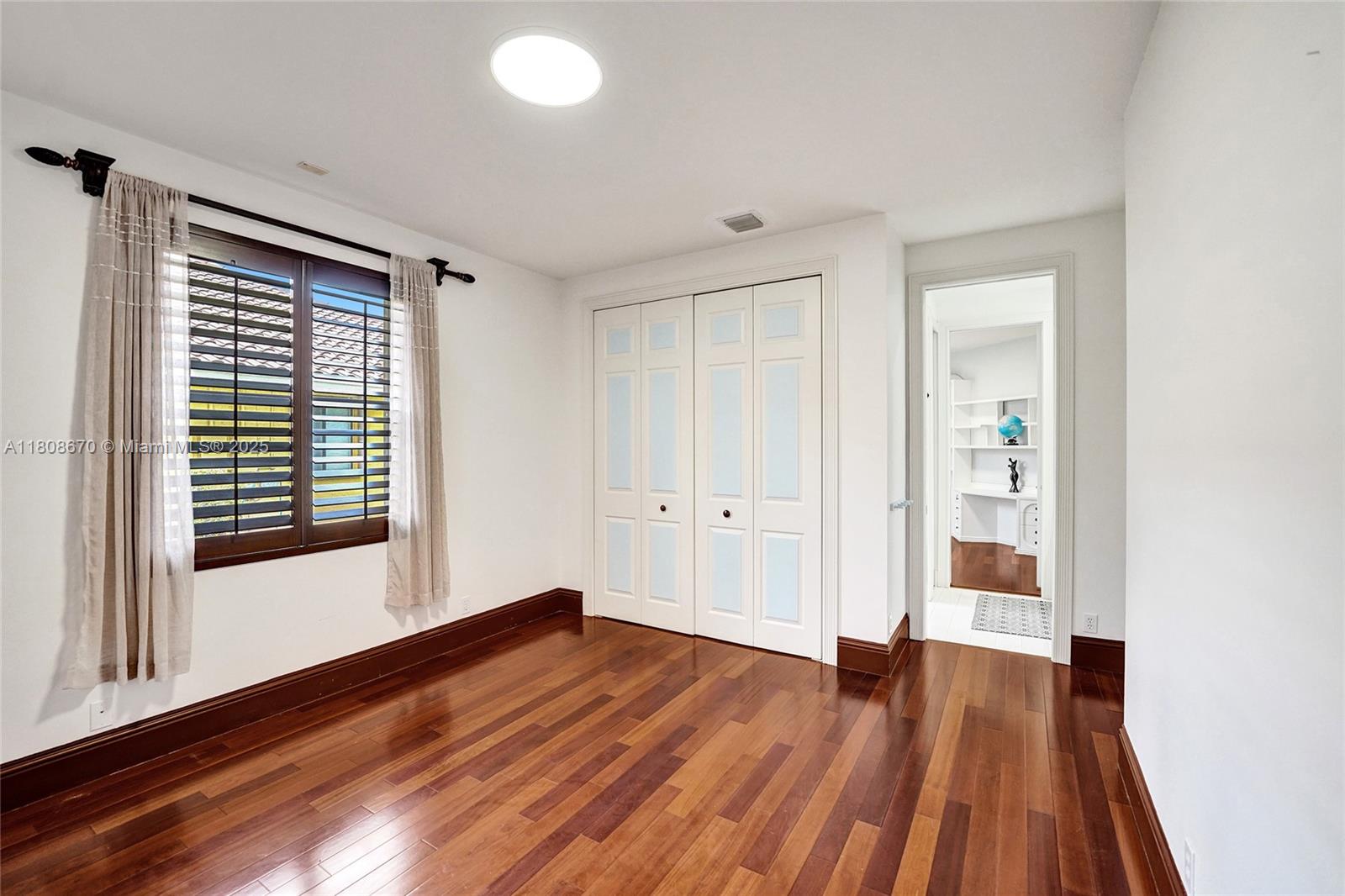169 Dockside Circle Weston, FL 33327 - Photo 40 of 61 wooden floor in an empty room with a window