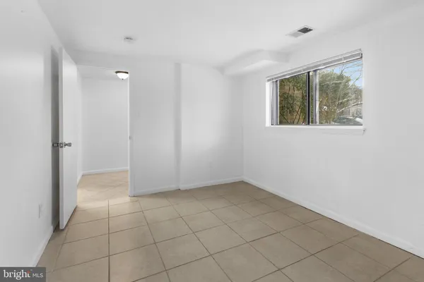 a view of an empty room with a window