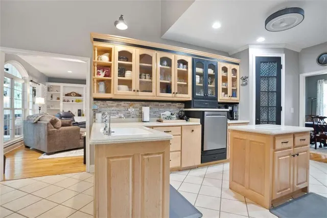 a kitchen with stainless steel appliances granite countertop a stove and a sink