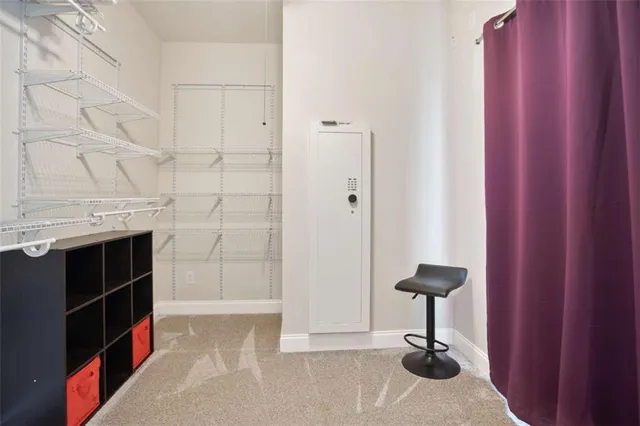 a view of empty room with a fireplace and cabinet
