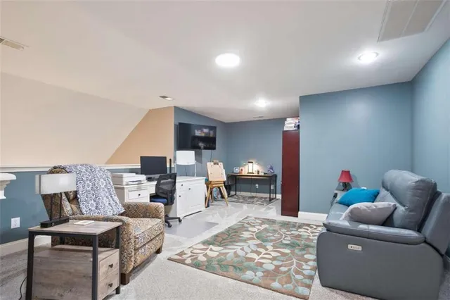 a living room with furniture and a couch