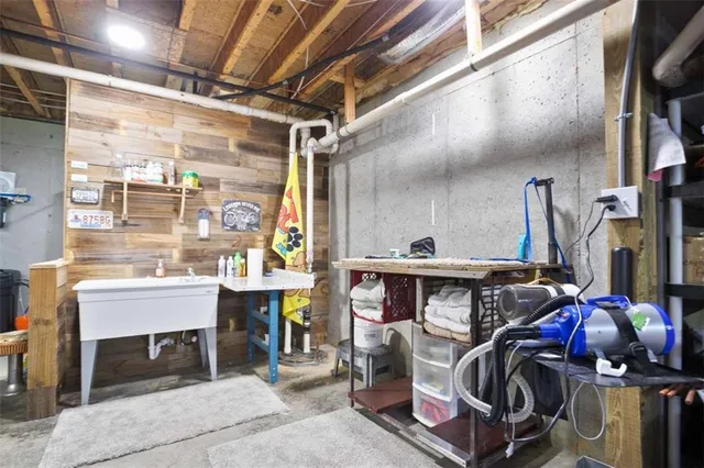a front view of a house with a yard and trees